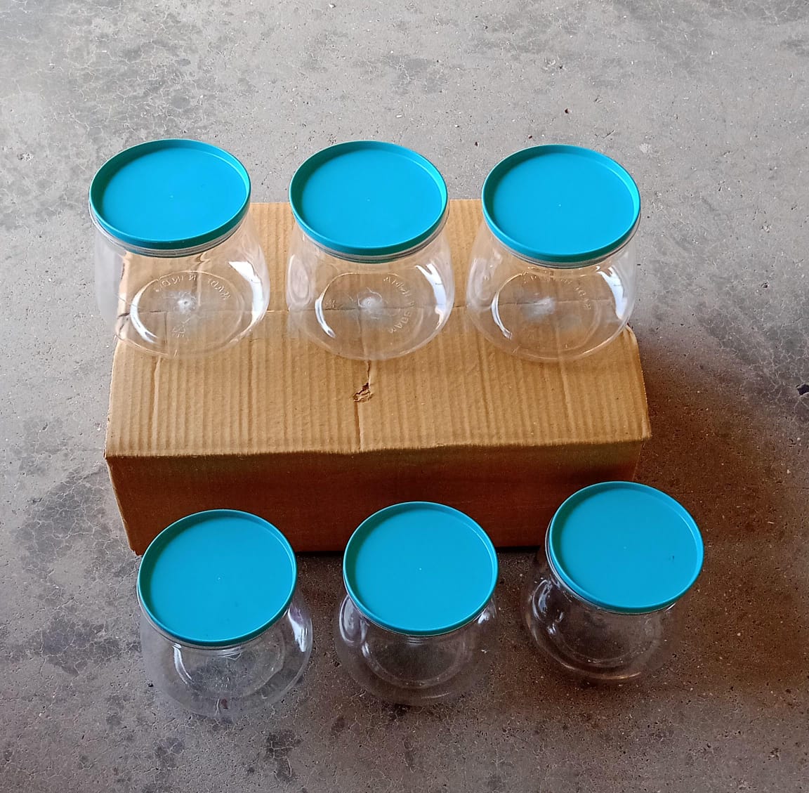Set of 6 multicolour matka-shaped jars with airtight lids Set of 6 multicolour matka-shaped jars with airtight lids